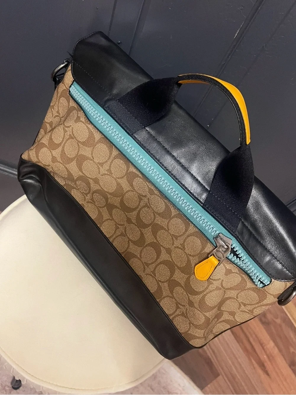 Coach Black Leather Messenger Bag with Red and Yellow Accents